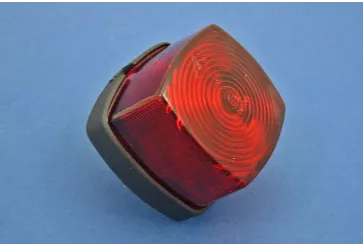 Tail lamp - rubber-mounted black plastic base with red lens